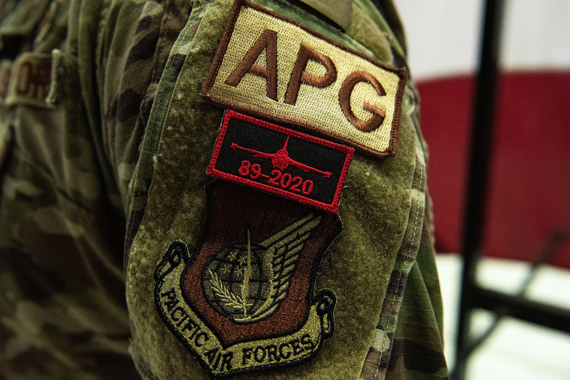 An Airman with the 36th Aircraft Maintenance Unit wears their new patch after being appointed a dedicated crew chief at Osan Air Base, Republic of Korea, March 21, 2022. The DCCs were presented with patches, along with a coin and certificate, to commemorate the milestone of becoming a DCC.