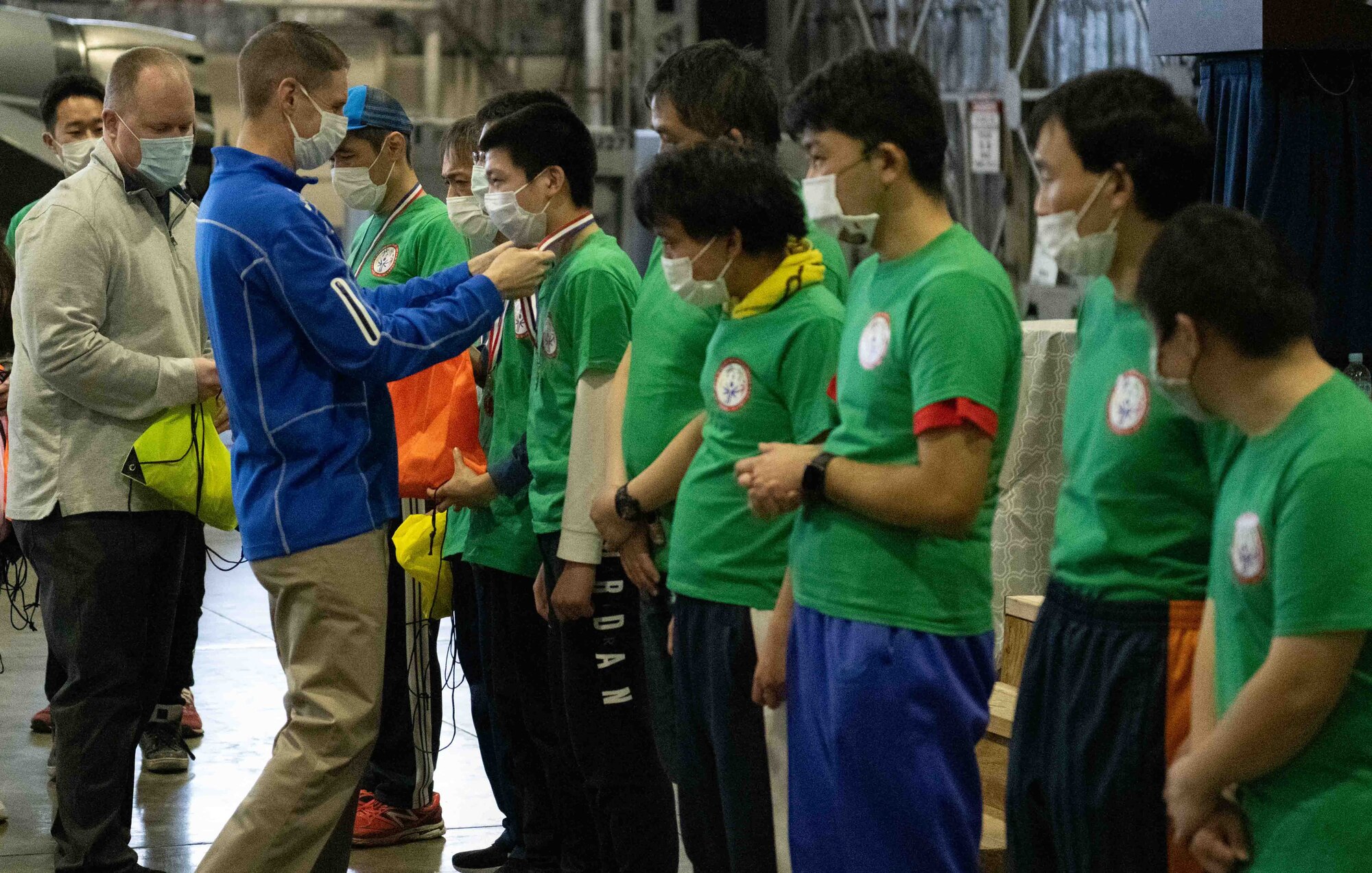 Military members presents medals to the athletes at the event.