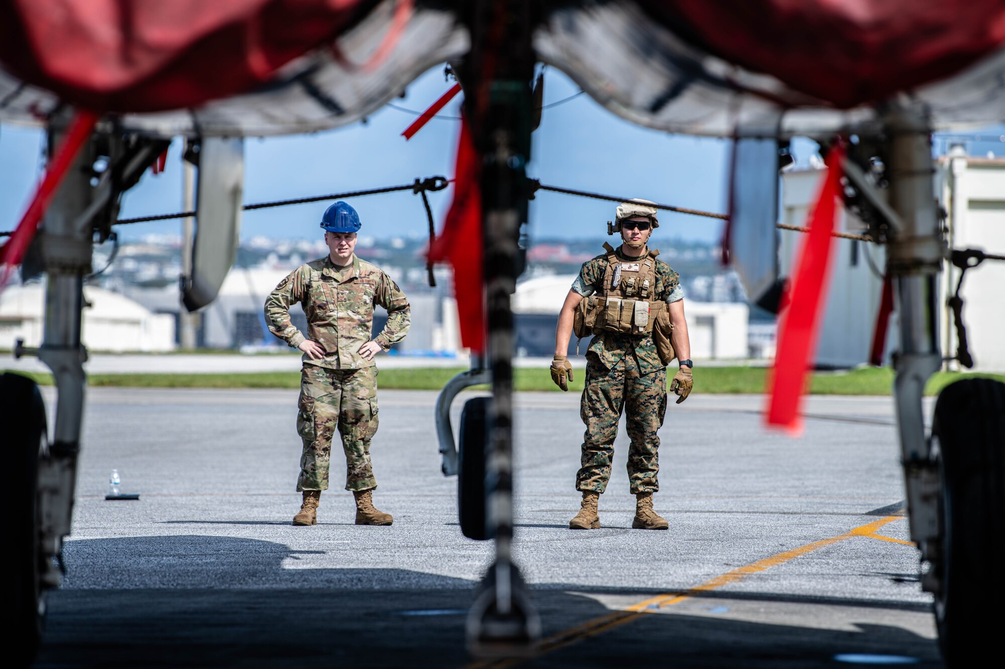 Airman and Marine check for safety.