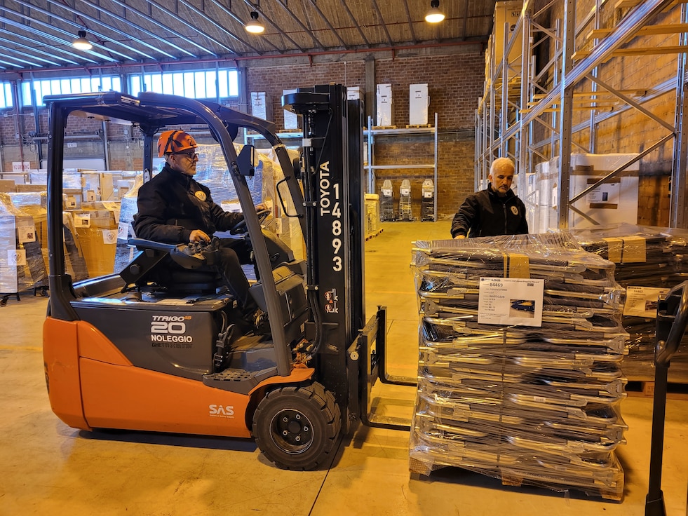 A forklift driver at a warehouse in Livorno, Italy, moves a pallet of Humanitarian Assistance Program cargo, specially sleeping cots, which was shipped April 5 to Moldova to assist the government there with helping to support displaced Ukrainians entering their country. Per a request from the U.S. Embassy in Moldova and approved by the Defense Security Cooperation Agency, the sleeping cots plus some generators were prepared for shipment, thanks to a special HAP team at Livorno, which is administratively assigned to Logistics Readiness Center Italy, 405th Army Field Support Brigade. (U.S. Army courtesy photo)