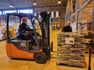 A forklift driver at a warehouse in Livorno, Italy, moves a pallet of Humanitarian Assistance Program cargo, specially sleeping cots, which was shipped April 5 to Moldova to assist the government there with helping to support displaced Ukrainians entering their country. Per a request from the U.S. Embassy in Moldova and approved by the Defense Security Cooperation Agency, the sleeping cots plus some generators were prepared for shipment, thanks to a special HAP team at Livorno, which is administratively assigned to Logistics Readiness Center Italy, 405th Army Field Support Brigade. (U.S. Army courtesy photo)