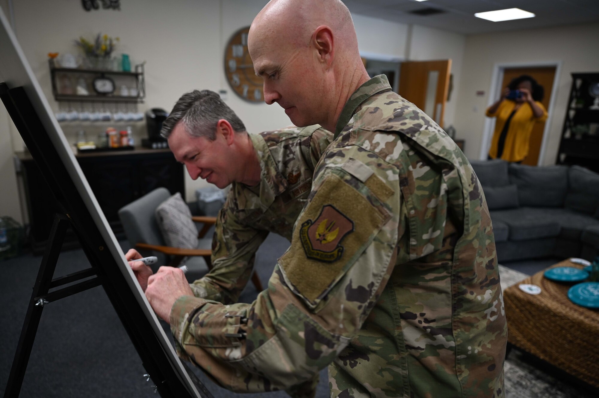 U.S. Air Force Col. Jason Herring, 100th Air Refuling Wing vice commander, and U.S. Air Force Col. Jason Culinga, 352nd Special Operations Wing vice commander, sign a proclamation designating April as Sexual Assault Awareness and Prevention Month at Royal Air Force Mildenhall, England, April 1, 2022. Protecting Airmen against sexual assault contributes to a ready force capable of executing the mission. (U.S. Air Force photo by Airman 1st Class Viviam Chiu).