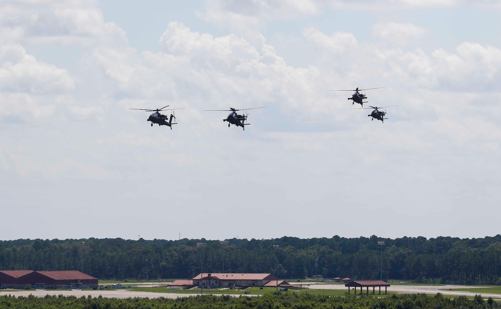 A group of four AH-64E Apache helicopters arrive at Hunter Army Airfield, Georgia after a four-day journey on July 16, 2021. (U.S. Army photo by Sgt. Savannah Roy)