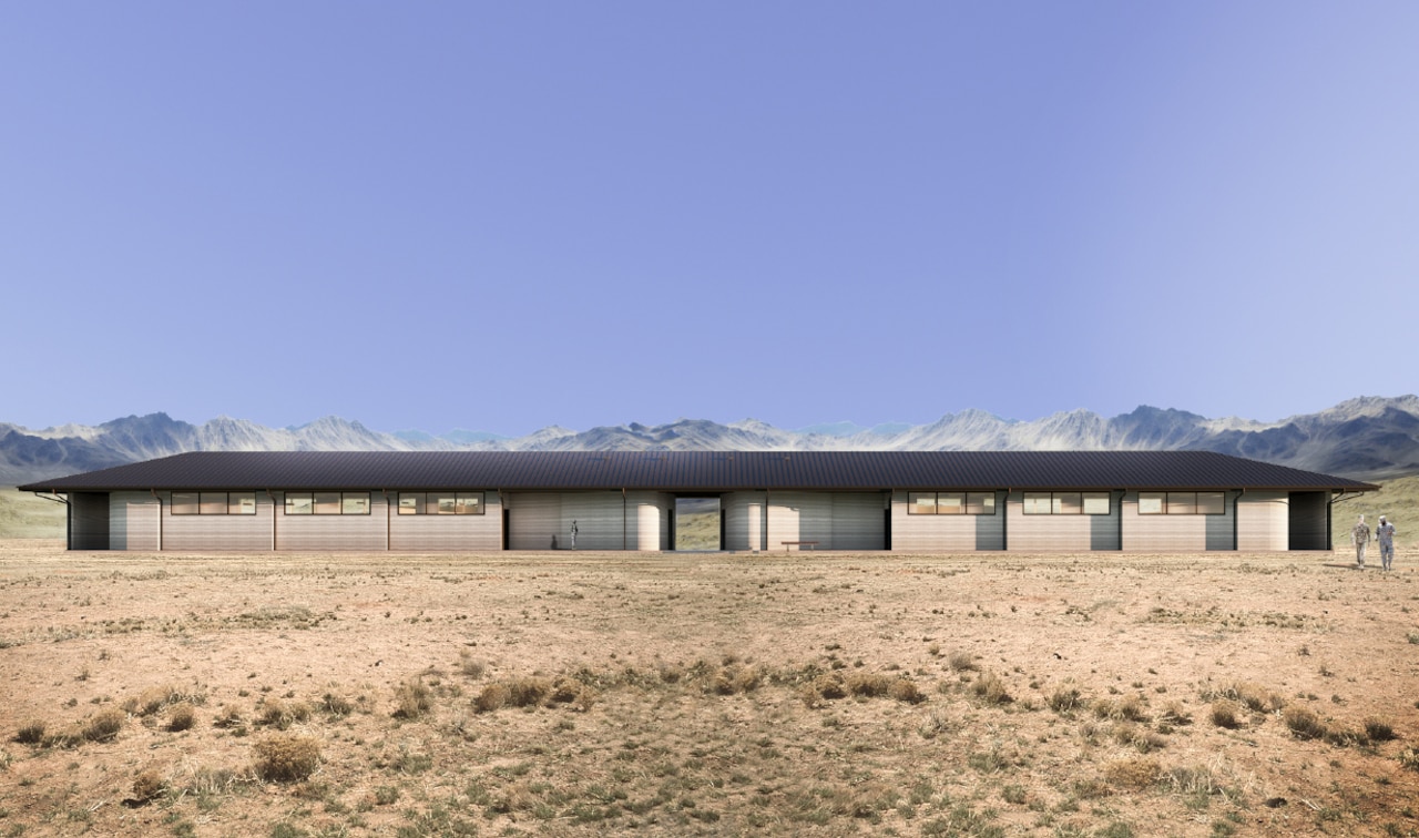 A conceptual single-story building is pictured in a desert climate.