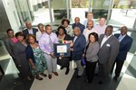 Lula Manley stands surrounded by friends and family