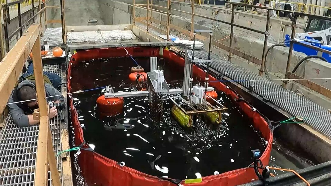 The U.S. Army Engineer Research and Development Center’s Cold Regions Research and Engineering Laboratory (CRREL) engages CRREL’s wave tank while testing an oil slick measuring device designed by the American University of Beirut for the Bureau of Safety and Environmental Enforcement.