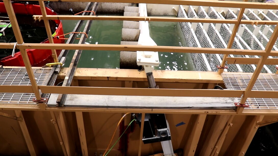 The U.S. Army Engineer Research and Development Center’s Cold Regions Research and Engineering Laboratory (CRREL) engages CRREL’s wave tank while testing an oil slick measuring device designed by the American University of Beirut for the Bureau of Safety and Environmental Enforcement.