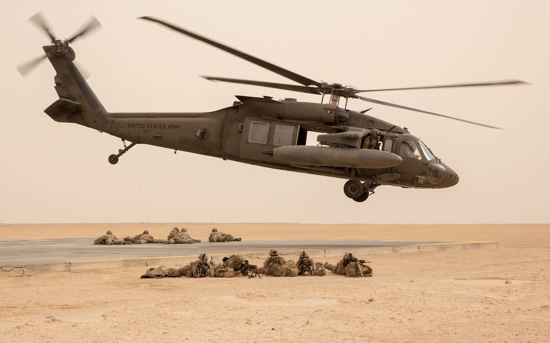 A U.S. Army UH-60 takes off after dismounting U.S. Army troops with 3rd Brigade Combat Team, 10th Mountain Division during a training event near Camp Buehring, Kuwait, Feb. 4, 2022. (U.S. Army photo by Spc. Damian Mioduszewski) (Portions of this image have been masked for security reasons)