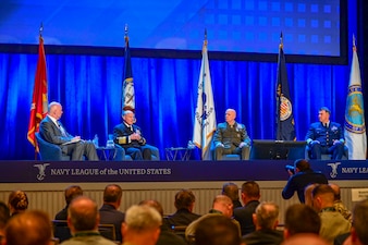 NATIONAL HARBOR, Md. (Apr. 4, 2022) Chief of Naval Operations (CNO) Adm. Mike Gilday, left center, speaks during a panel comprised of himself, Commandant of the Marine Corps Gen. David H. Berger and Commandant of the Coast Guard Admiral Karl Schultz, during the 2022 Sea-Air-Space Exposition. The Sea-Air-Space Exposition is an annual event that brings together key military decision makers, the U.S. defense industrial base and private-sector companies for an innovative and educational maritime focused event. (U.S. Navy photo by Mass Communication Specialist 1st Class Sean Castellano/Released)