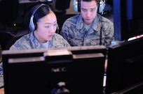 Senior Airman Jennifer Anderson (left) and Staff Sgt. Zachary Nottingham, 71st Expeditionary Air Control Squadron weapons directors, communicate with downrange aircraft from a non-disclosed Southwest Asia location 13 January 2010. The weapons directors help provide troops on the ground with appropriate air support. (Photo by SrA Kasey Zickmund, USAF)