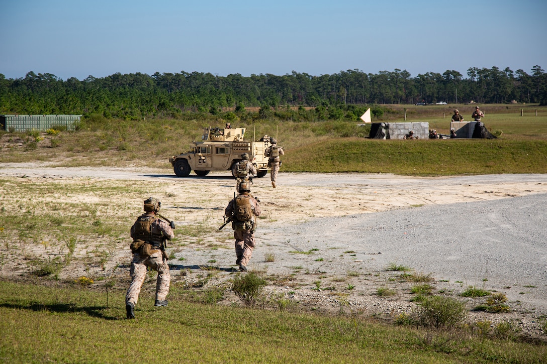 Marine Raiders conduct assaults as a Marine special operations company in Jacksonville, N.C., Oct. 1, 2021. The training gave the Marine Raiders an opportunity to work together as a company sized element before conducting team level training. (U.S. Marine Corps photo by Cpl. Ethan Green)