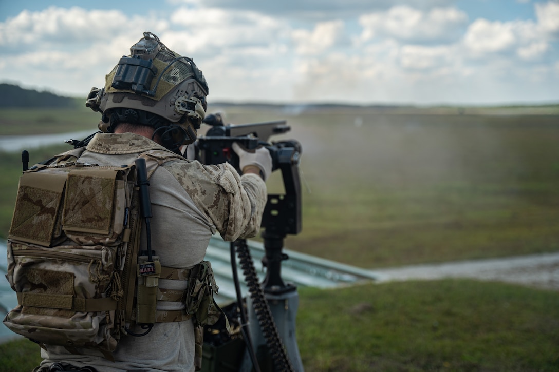 Marine Raiders fire the MK 44 minigun during a company training event in Jacksonville, N.C., Oct. 1, 2021. The Marine Raiders refined their marksmanship techniques on various weapons systems including sniper rifles, machine guns and grenade launchers prior to conducting team level training. (U.S. Marine Corps photo by Cpl. Ethan Green)