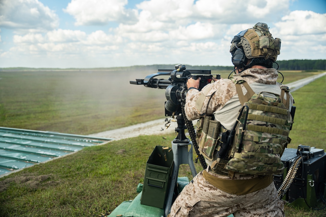 Marine Raiders fire the MK44 minigun during a company training event in Jacksonville, N.C., Oct. 1, 2021. The Marine Raiders refined their marksmanship techniques on various weapons systems including sniper rifles, machine guns and grenade launchers prior to conducting team level training. (U.S. Marine Corps photo by Cpl. Ethan Green)