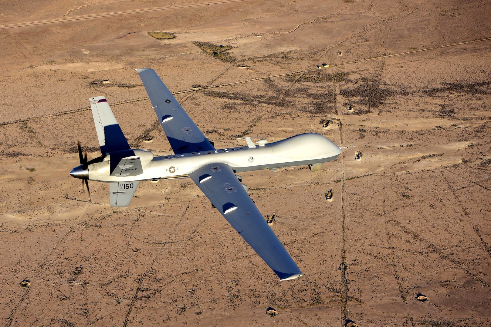 An MQ-9 Reaper flies a training mission over the Nevada Test and Training Range, July 15, 2019. MQ-9 crews can utilize kill boxes to perform air interdiction missions. (USAF photo by A1C William Rio Rosado)