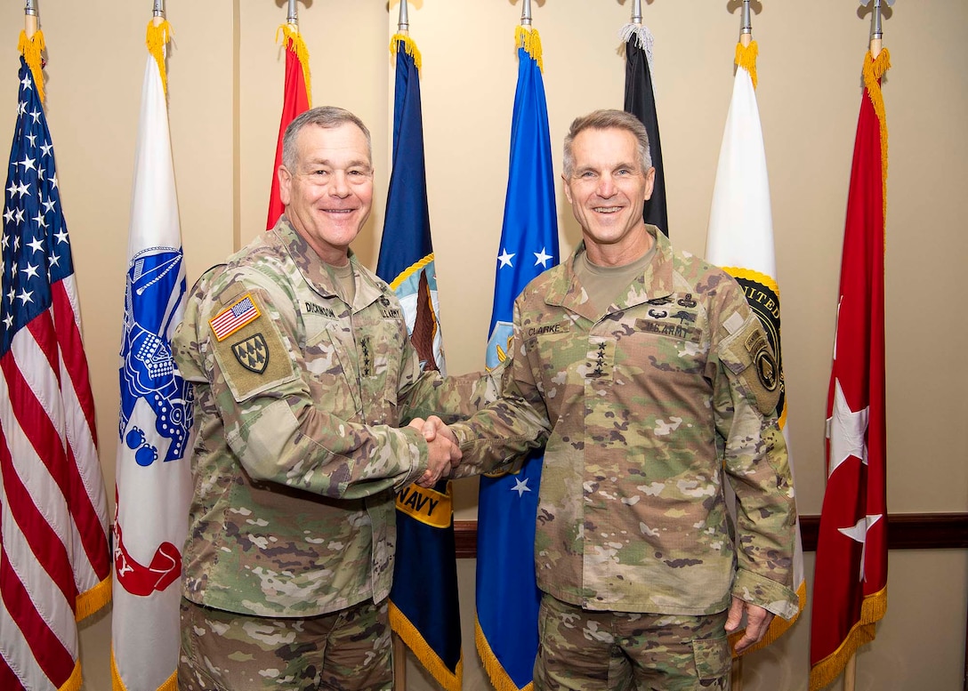 U.S. Army Gen. James Dickinson, U.S. Space Command commander, met with U.S. Army Gen. Richard Clarke, U.S. Special Operations Command commander, to reaffirm the importance of partnerships in a joint environment to defend U.S. vital interests with allies and partners at USSOCOM headquarters on MacDill Air Force Base, Fla., March 31, 2022.