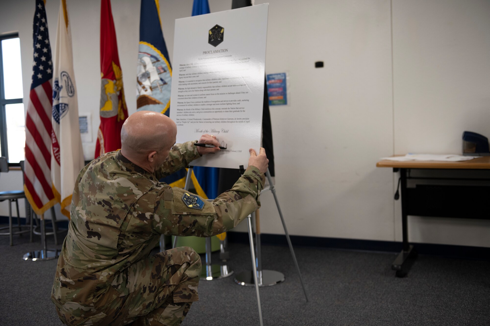 Military member signs proclamation