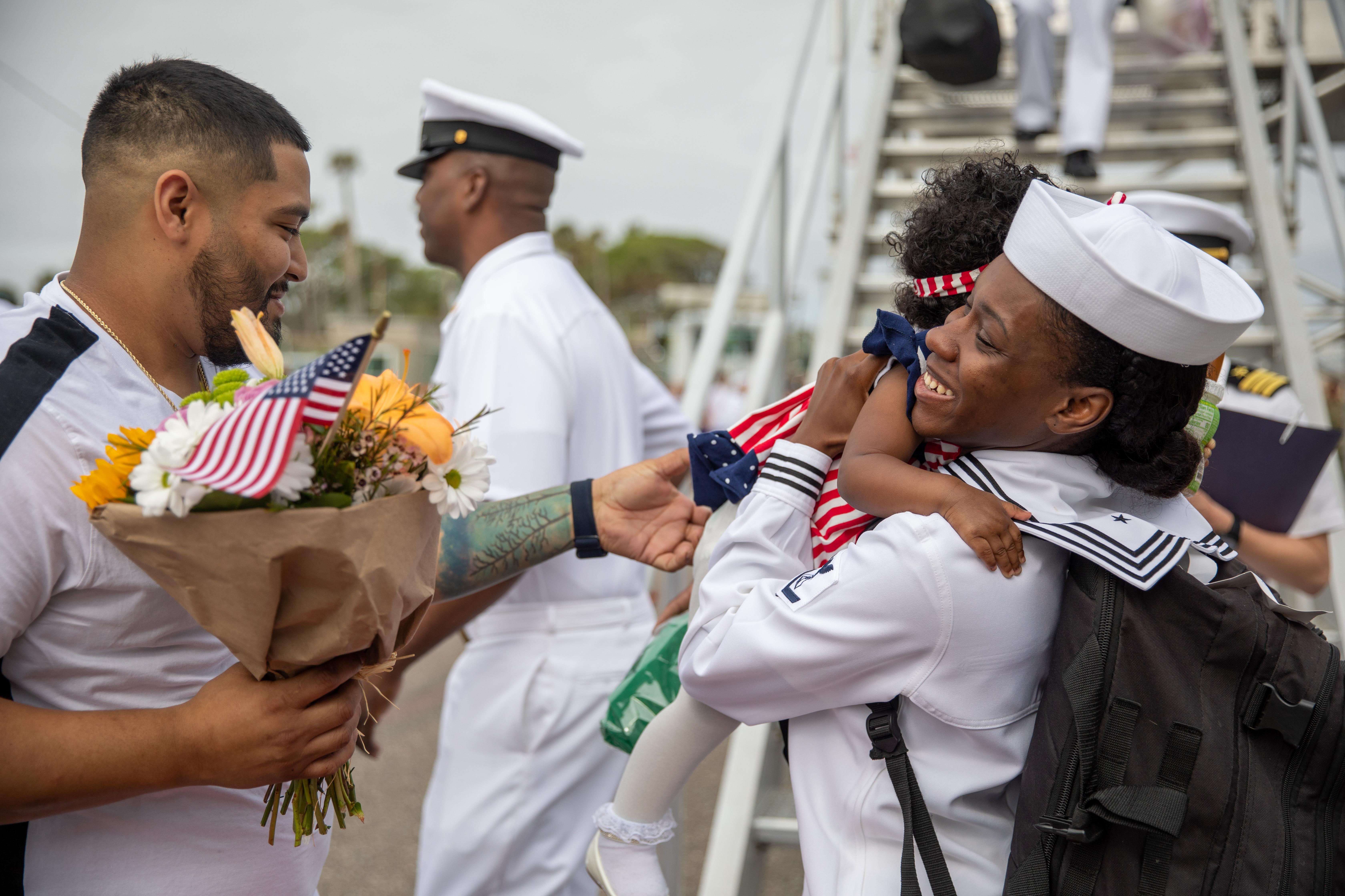Culinary Specialist 3rd Class Angel Hall, assigned to the Freedom-variant littoral combat ship USS Milwaukee (LCS 5), reunites with her daughter as the ship returns from deployment to Naval Station Mayport.
