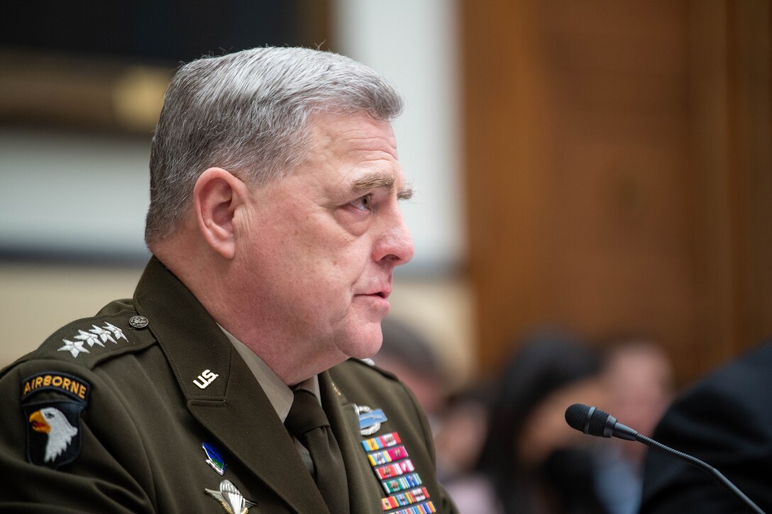 Army Gen. Mark A. Milley speaks into microphone.