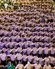 Navy Junior ROTC cadets and staff salute during the 2022 Navy Junior ROTC National Academic, Athletic, and Drill Competition awards ceremony in pensacola, Fla.