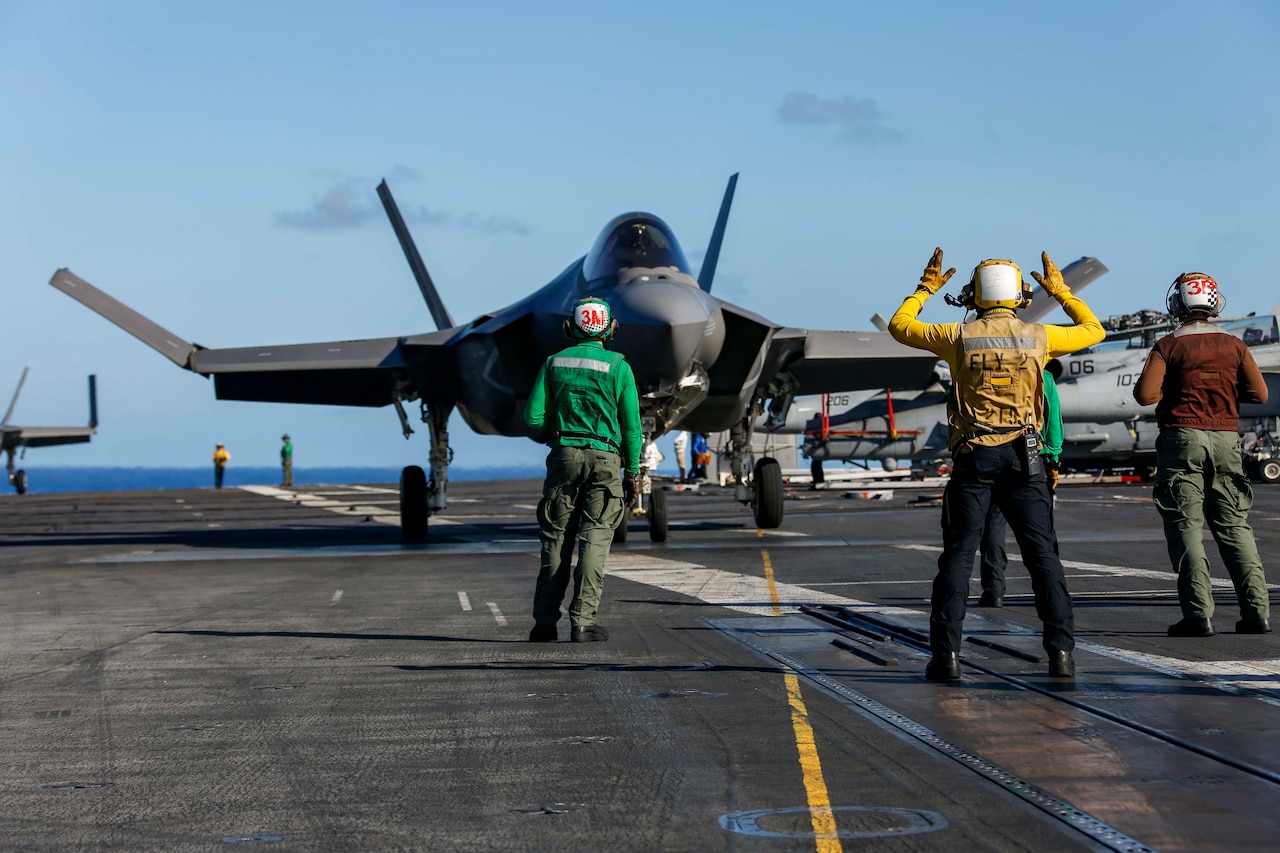 Jet prepares to launch off carrier.