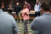 Neykia Declouet, interagency plans coordinator at Joint Task Force Civil Support, briefs personnel in preparation for a terrain appreciation walkthrough at Fort Hood, Tx.