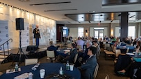 Joint Task Force Civil Support Chief of Staff Col. Christopher Caldwell gives a presentation during Defense Strategies Institute’s Joint Civil and DoD CBRN symposium at the National Harbor in Maryland, March 24, 2022.