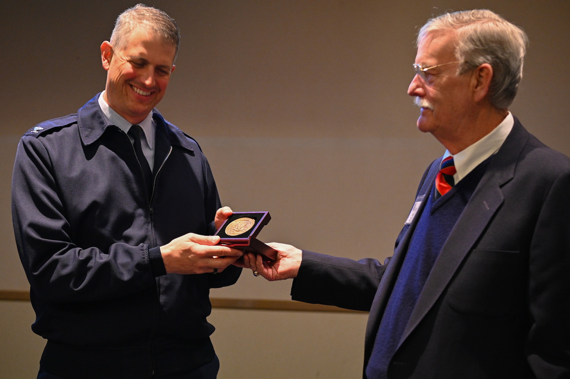 Col. Robert Long, Space Launch Delta 30 commander, receives a coin from the president of the Defense Orientation Conference Association on Vandenberg Space Force Base, Calif., March 29, 2022. DOCA is a nationwide nonprofit organization dedicated to continuing education in defense and national security affairs. (U.S. Space Force photo by Airman 1st Class Kadielle Shaw)