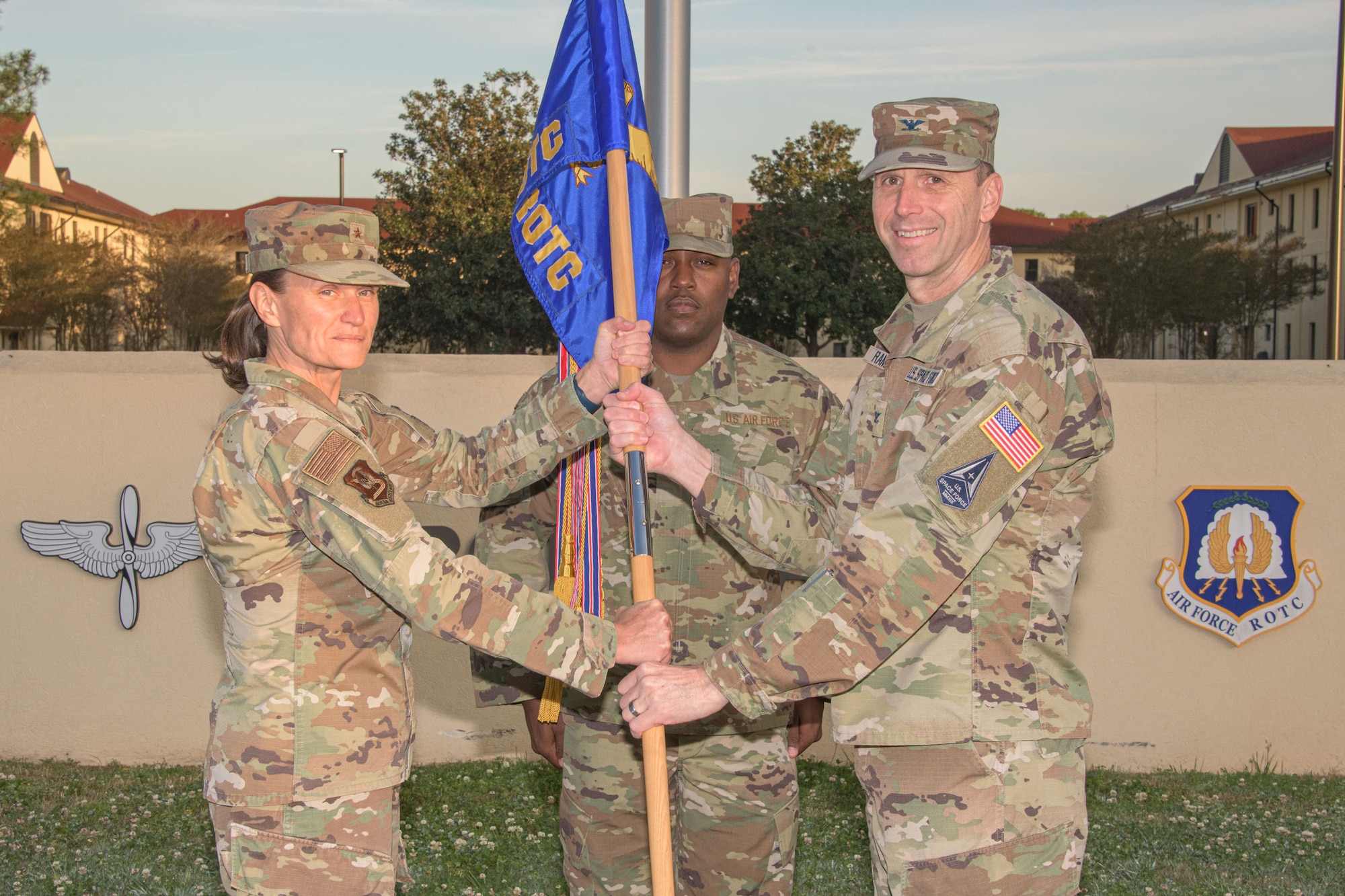 Brig. Gen. Leslie Maher, commander of the Jeanne M. Holm Center for Officer Accessions and Citizen Development, hands the Air Force ROTC flag to U.S. Space Force Col. Corey Ramsby during a change of command ceremony at Maxwell Air Force Base, Ala., April 4, 2022. Ramsby is the first Space Force officer to command Air Force ROTC. The previous commander, Col. Christopher Bennett, is retiring from the Air Force after 29 years of service.