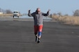 Senior Master Sgt. Brian E. Zarilla, the 111th Mission Support Group senior enlisted leader, celebrates as he nears the finish line during the Sexual Assault Awareness and Prevention 5K on Saturday, April 2, 2022 at Biddle Air National Guard Base, Horsham, PA. The 111th Attack Wing sexual assault response coordinator hosted the run to support sexual assault awareness and prevention month.