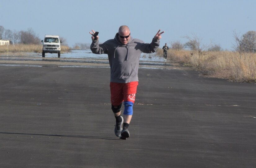 Senior Master Sgt. Brian E. Zarilla, the 111th Mission Support Group senior enlisted leader, celebrates as he nears the finish line during the Sexual Assault Awareness and Prevention 5K on Saturday, April 2, 2022 at Biddle Air National Guard Base, Horsham, PA. The 111th Attack Wing sexual assault response coordinator hosted the run to support sexual assault awareness and prevention month.