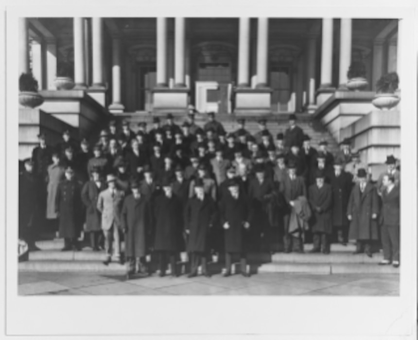 The United States Delegation to the conference, photographed on the steps of the State-War-Navy Building, Pennsylvania Ave. At 17th St., Washington, D.C., in November 1921. Among those present are: Admiral Robert E. Coontz, USN Chief of Naval Operations (left end of second row), Rear Admiral William V. Pratt, USN, directly behind Coontz).