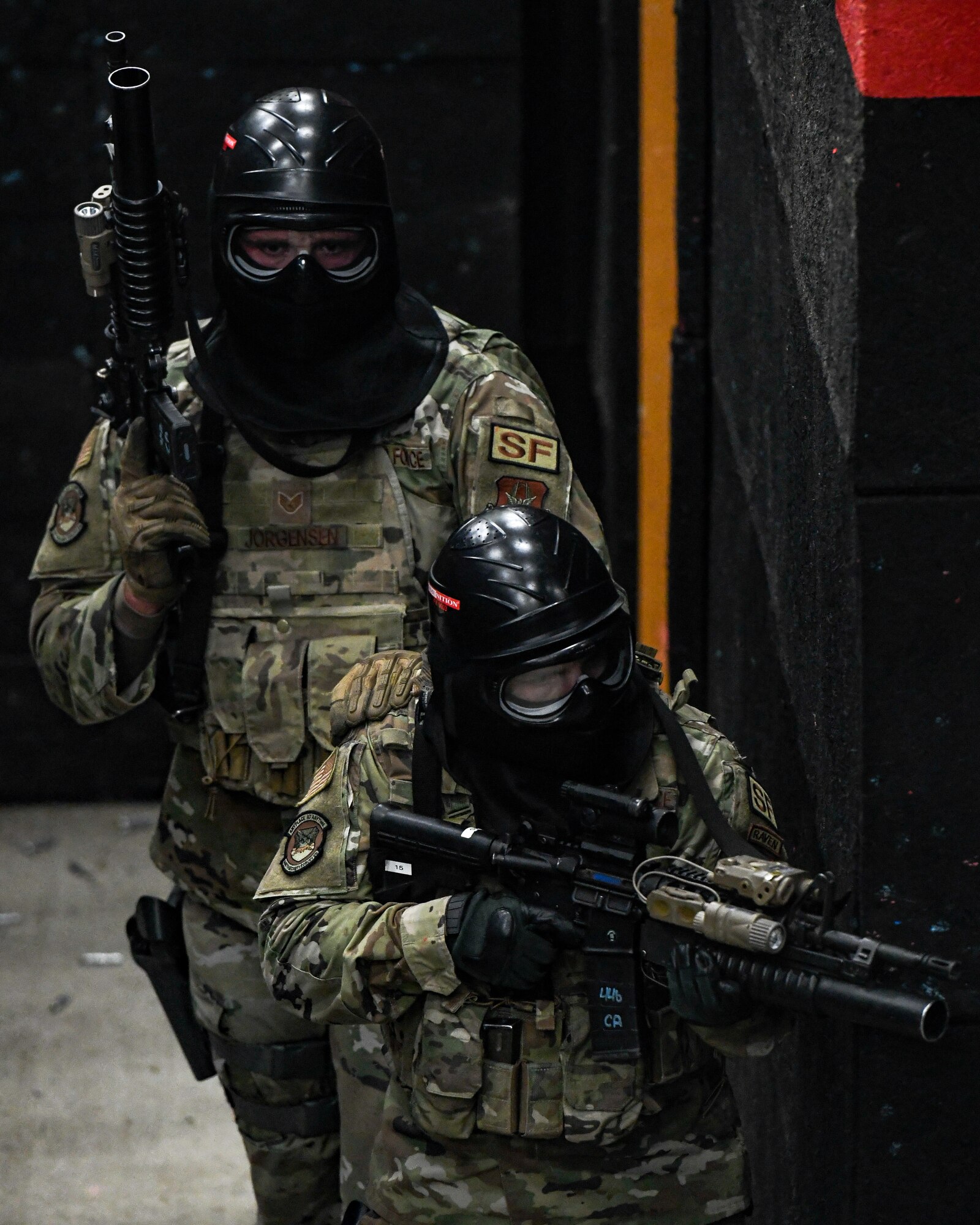 Air Force Reserve Command Defenders assigned to the 446th Security Forces Squadron, Joint Base Lewis-McChord, Washington, work their way through a live-fire training scenario, March 20, 2022, at the shoot-house at Camp James A. Garfield Joint Military Training Center, Ohio.