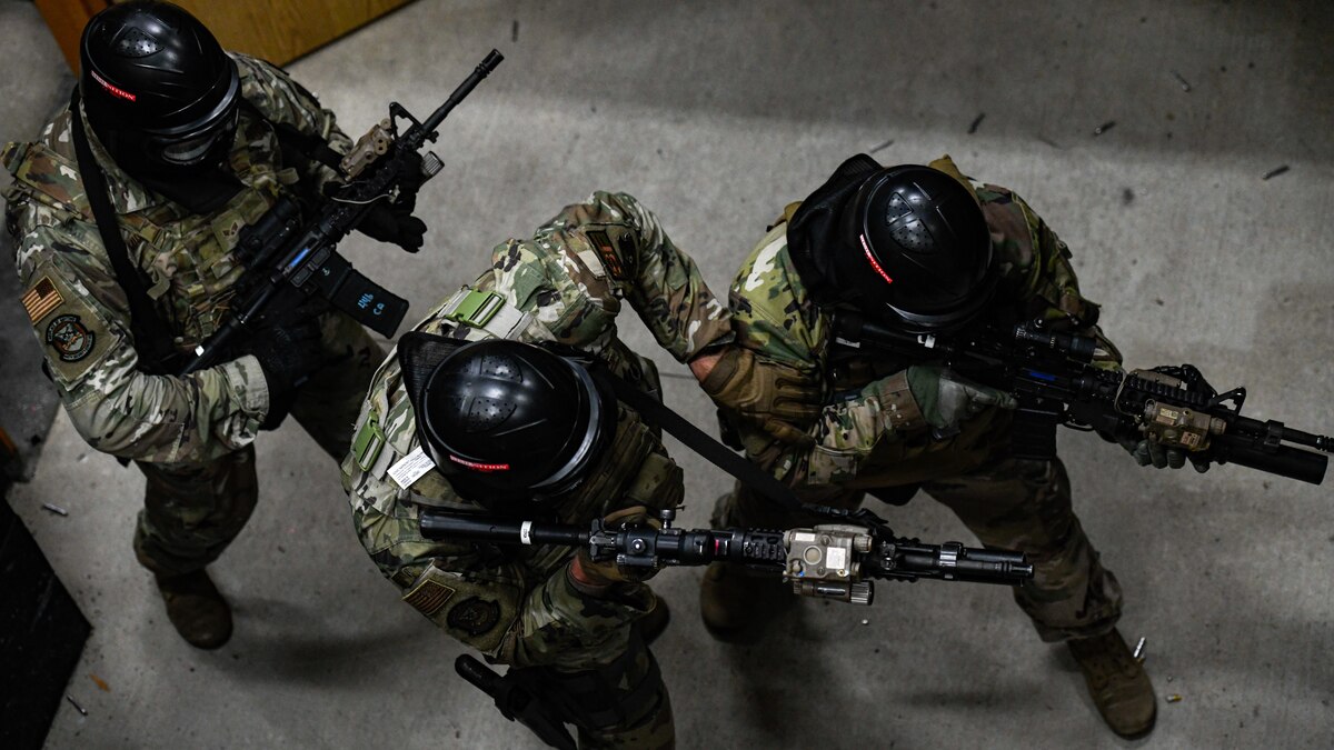 Air Force Reserve Command Defenders assigned to the 446th Security Forces Squadron, Joint Base Lewis-McChord, Washington, work their way through a live-fire training scenario, March 20, 2022, at the shoot-house at Camp James A. Garfield Joint Military Training Center, Ohio.