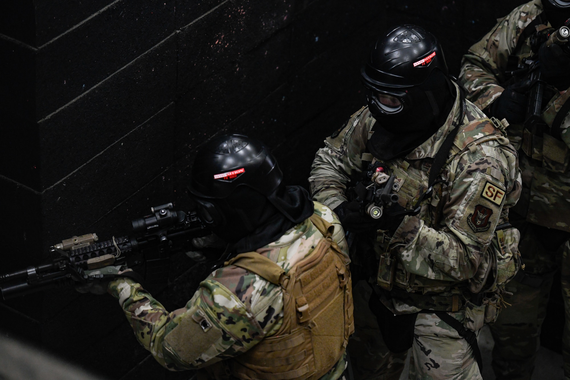 Air Force Reserve Command Defenders assigned to the 446th Security Forces Squadron, Joint Base Lewis-McChord, Washington, work their way through a live-fire training scenario, March 20, 2022, at the shoot-house at Camp James A. Garfield Joint Military Training Center, Ohio.