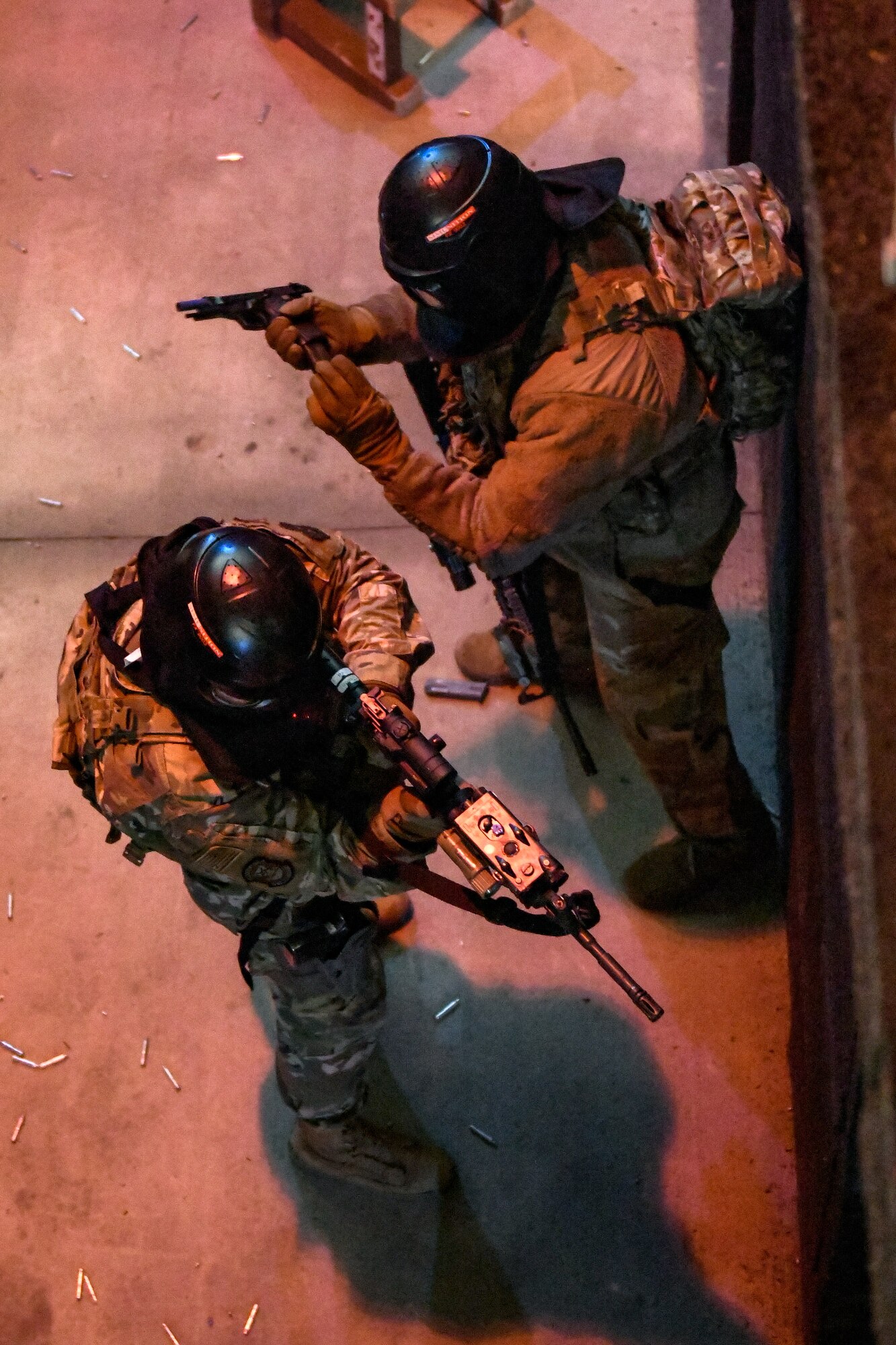 Air Force Reserve Command Defenders assigned to the 446th Security Forces Squadron, Joint Base Lewis-McChord, Washington, work their way through a live-fire training scenario, March 20, 2022, at the shoot-house at Camp James A. Garfield Joint Military Training Center, Ohio.