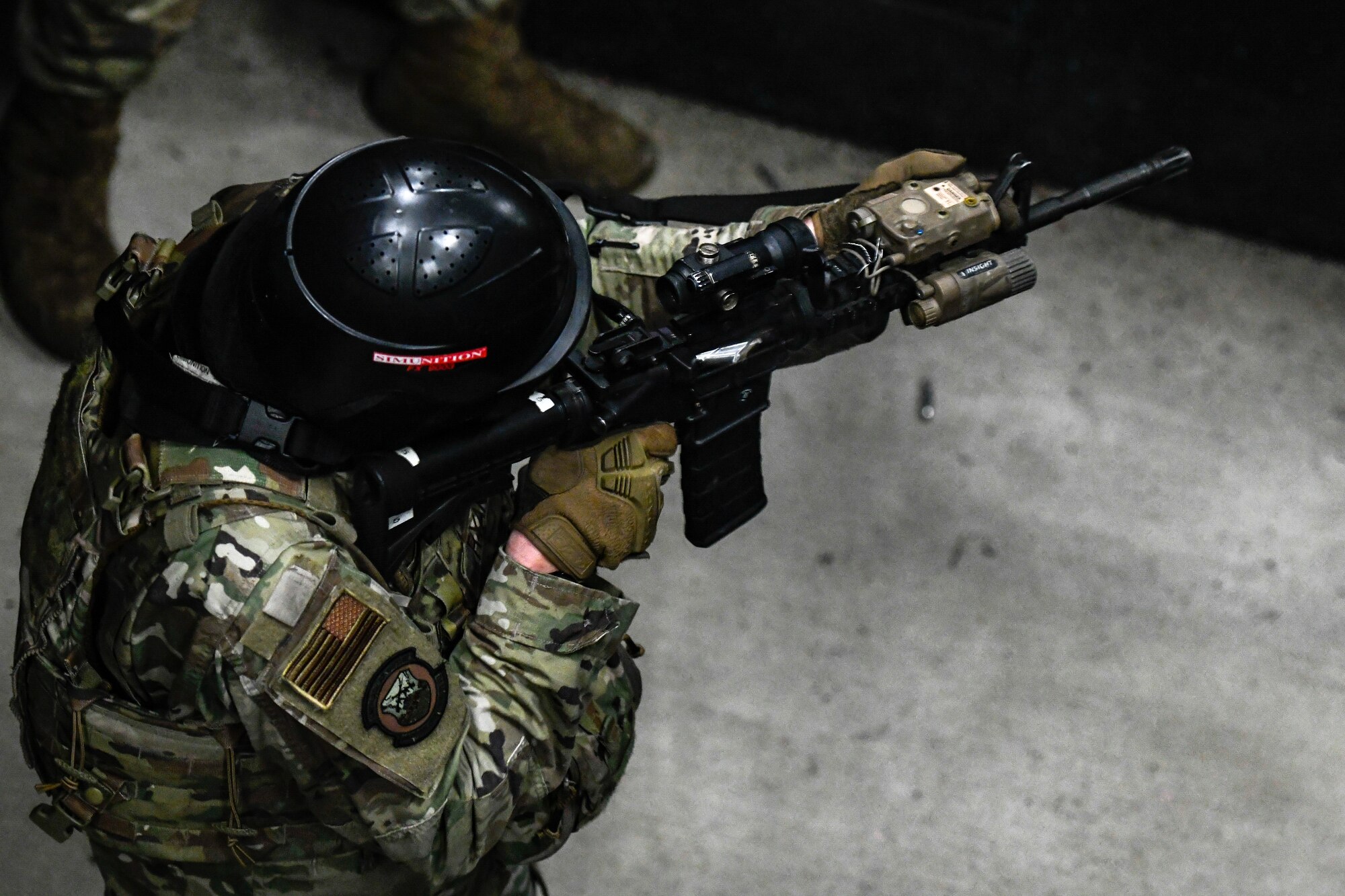 Air Force Reserve Command Defenders assigned to the 446th Security Forces Squadron, Joint Base Lewis-McChord, Washington, work their way through a live-fire training scenario, March 20, 2022, at the shoot-house at Camp James A. Garfield Joint Military Training Center, Ohio.
