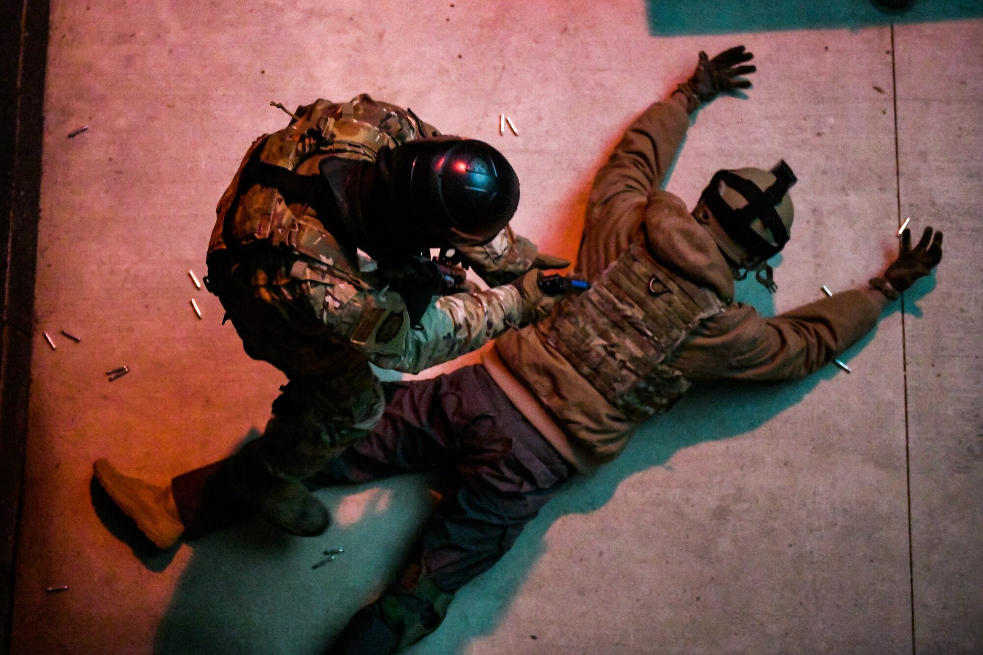 Air Force Reserve Command Defenders assigned to the 446th Security Forces Squadron, Joint Base Lewis-McChord, Washington, work their way through a live-fire training scenario, March 20, 2022, at the shoot-house at Camp James A. Garfield Joint Military Training Center, Ohio.