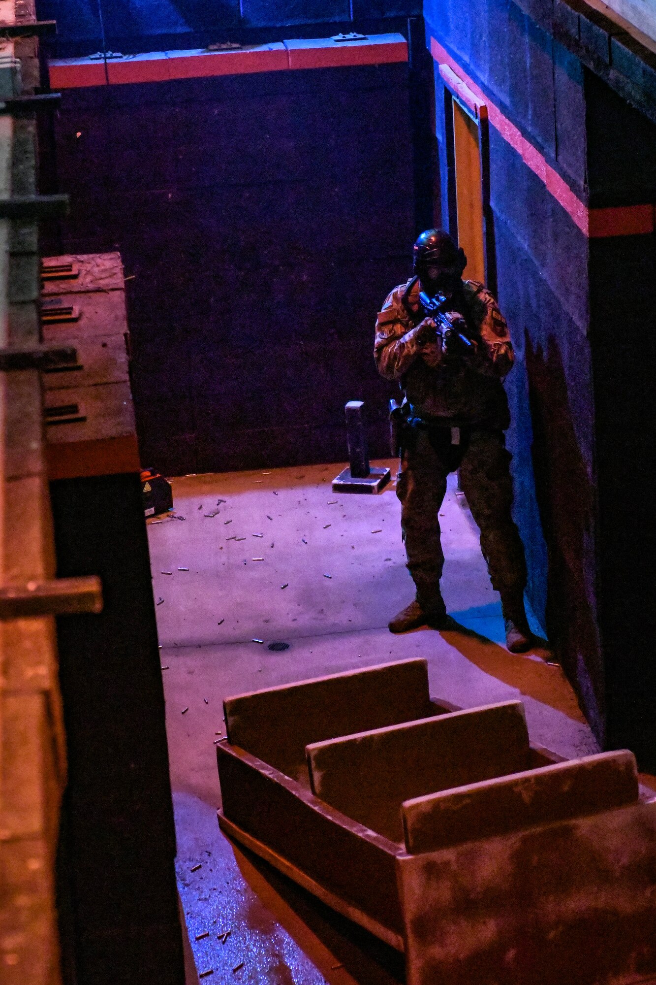 Air Force Reserve Command Defenders assigned to the 446th Security Forces Squadron, Joint Base Lewis-McChord, Washington, work their way through a live-fire training scenario, March 20, 2022, at the shoot-house at Camp James A. Garfield Joint Military Training Center, Ohio.