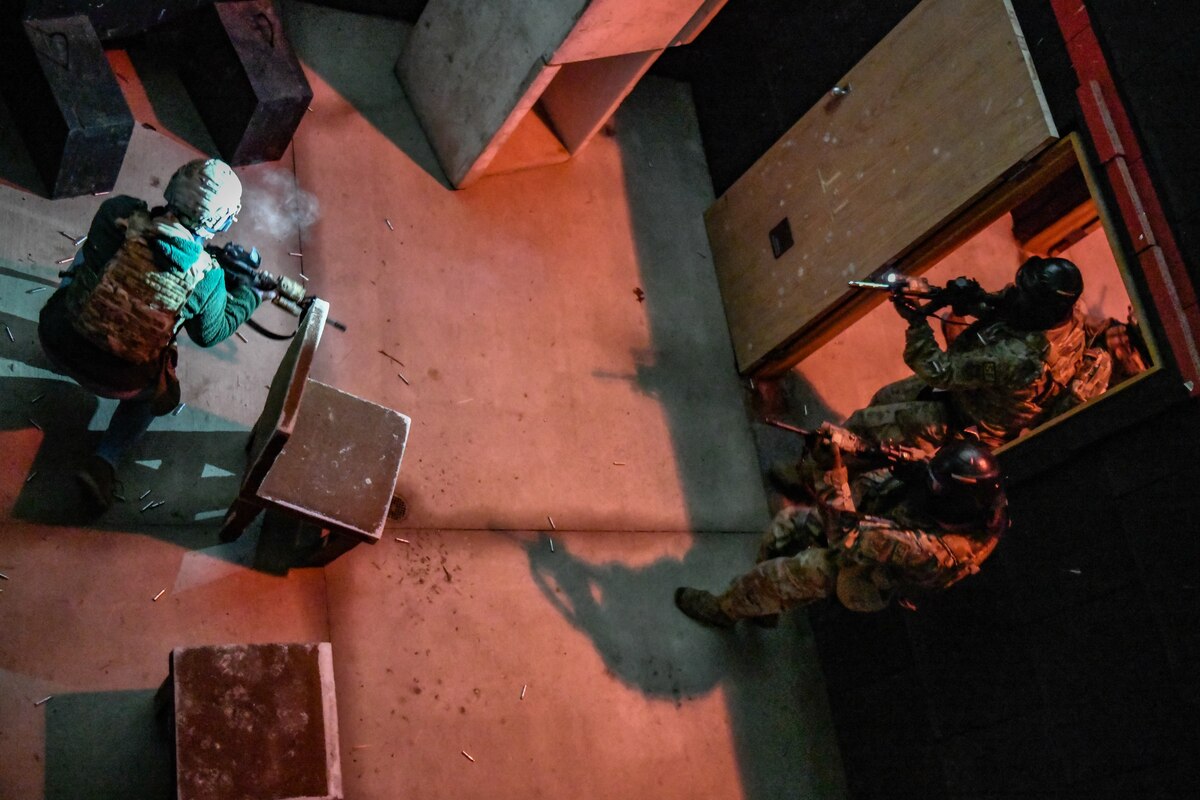 Air Force Reserve Command Defenders assigned to the 446th Security Forces Squadron, Joint Base Lewis-McChord, Washington, work their way through a live-fire training scenario, March 20, 2022, at the shoot-house at Camp James A. Garfield Joint Military Training Center, Ohio.