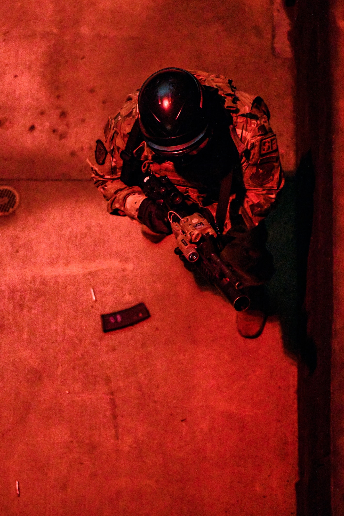 Air Force Reserve Command Defenders assigned to the 446th Security Forces Squadron, Joint Base Lewis-McChord, Washington, work their way through a live-fire training scenario, March 20, 2022, at the shoot-house at Camp James A. Garfield Joint Military Training Center, Ohio.