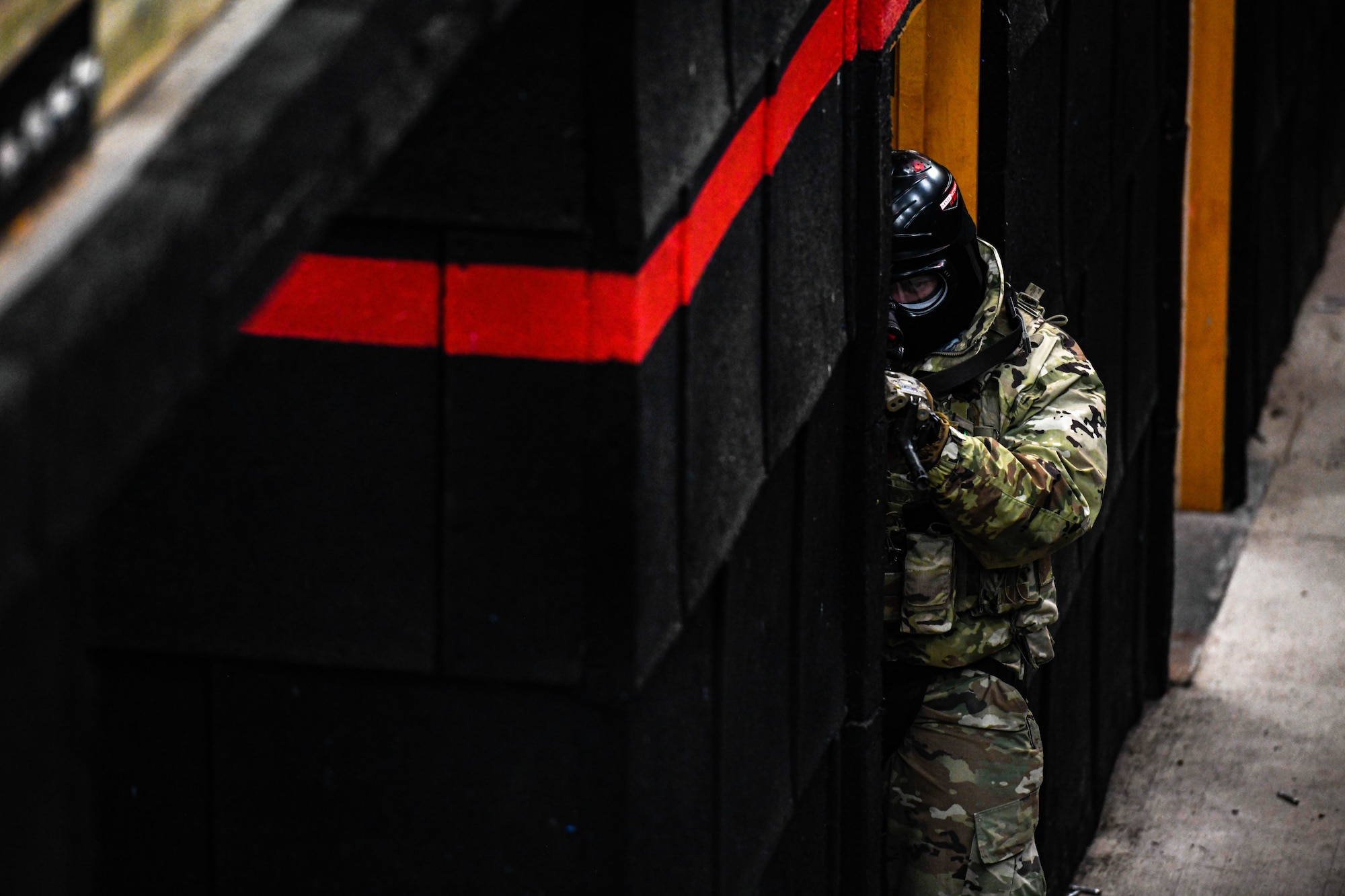 Air Force Reserve Command Defenders assigned to the 446th Security Forces Squadron, Joint Base Lewis-McChord, Washington, work their way through a live-fire training scenario, March 20, 2022, at the shoot-house at Camp James A. Garfield Joint Military Training Center, Ohio.