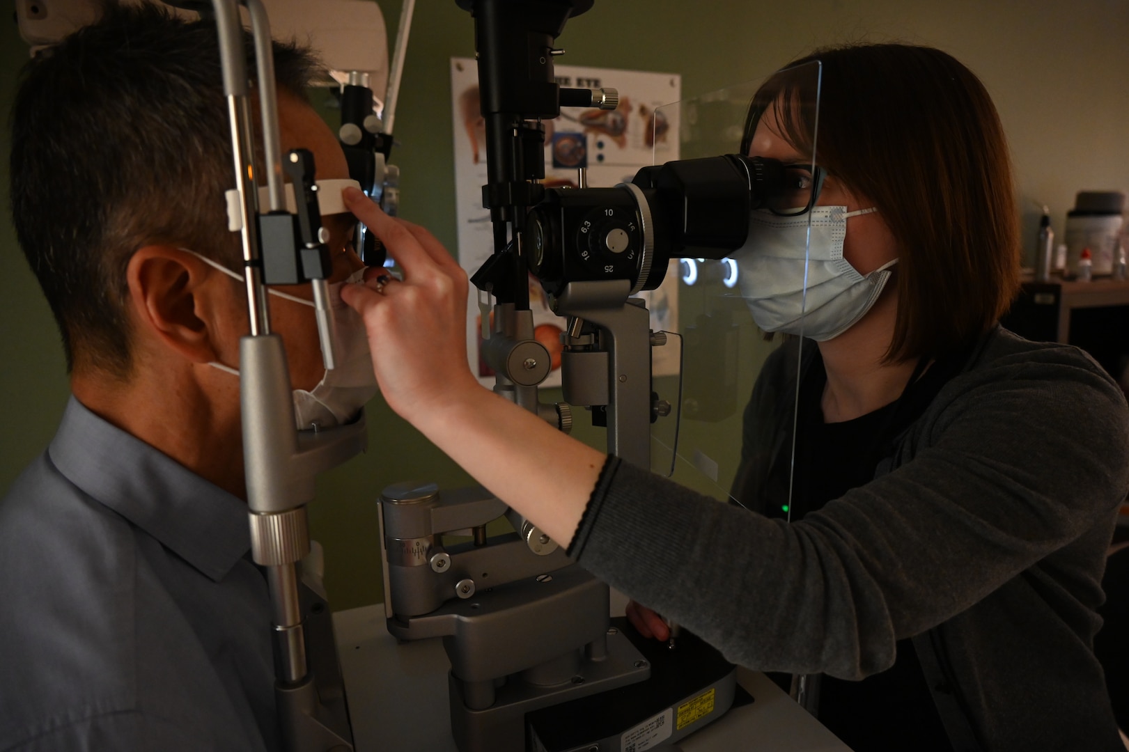 Dr. Janna Lambson, an optometrist at Kimbrough Ambulatory Care Center hired under the Joint Incentive Fund optometry program, provides a comprehensive eye exam to a VA beneficiary Feb. 22, Fort Meade, Maryland.
