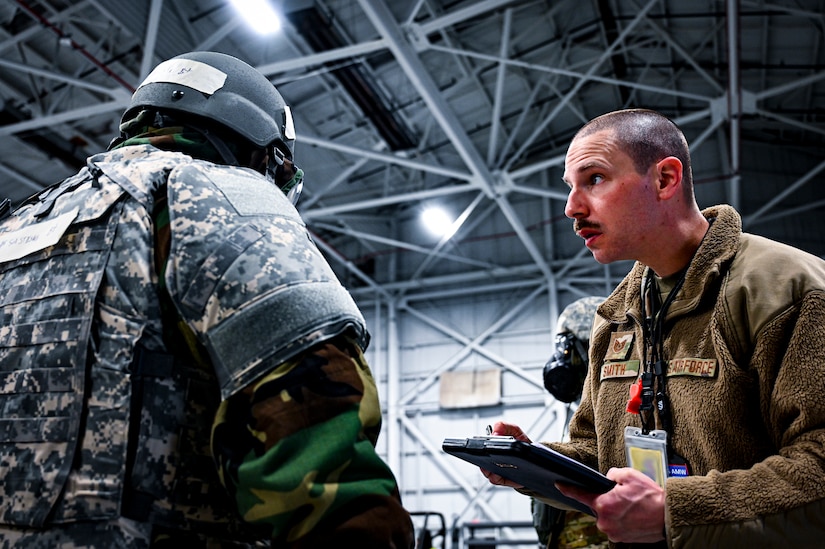 A U.S. Air Force Airman from the 305th Air Mobility Wing inspects Mission Oriented Protective Posture gear, demonstrating the ability to survive and operate in a contested environment during a readiness exercise at Joint Base McGuire-Dix-Lakehurst, New Jersey, Apr. 3, 2022. Training exercises reinforce Airmen readiness and deliberately strengthen Air Mobility Command’s warfighting culture in order to provide unrivaled Rapid Global Mobility capable of protecting and sustaining the Joint Force.