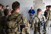 Jeffrey Haskins, an Army Expeditionary Warrior Experiment (AEWE) analyst, receives feedback from Soldiers during an Army Expeditionary Warrior Experiment (AEWE) force-on-force field demonstration held on Fort Benning, March 4. The demonstration at the AEWE event showcased the practical application of the Soldier-Borne Sensor, Nett Warrior and artificial intelligence working in tandem to enhance the situational awareness of the Soldier.