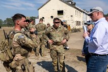 Raymond Fields, operational lead for Project INCISIVE, receives feedback from Soldiers after a force-on-force exercise during an Army Expeditionary Warrior Experiment (AEWE) demonstration held on Fort Benning, March 3. The demonstration at the AEWE event showcased the practical application of the SBS, Nett Warrior and artificial intelligence working in tandem to enhance the situational awareness of the Soldier.