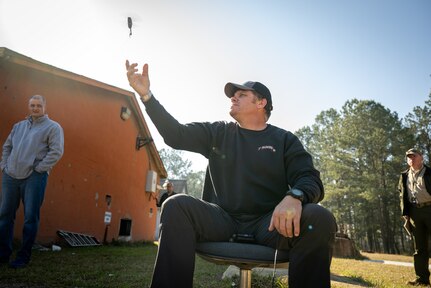 Brian Martin, an instructor for Program Executive Office, Soldier, launches the Soldier-Borne Sensor (SBS) during an Army Expeditionary Warrior Experiment (AEWE) force-on-force field demonstration held on Fort Benning, March 4. The demonstration at the AEWE event showcased the practical application of the SBS, Nett Warrior and artificial intelligence working in tandem to enhance the situational awareness of the Soldier.