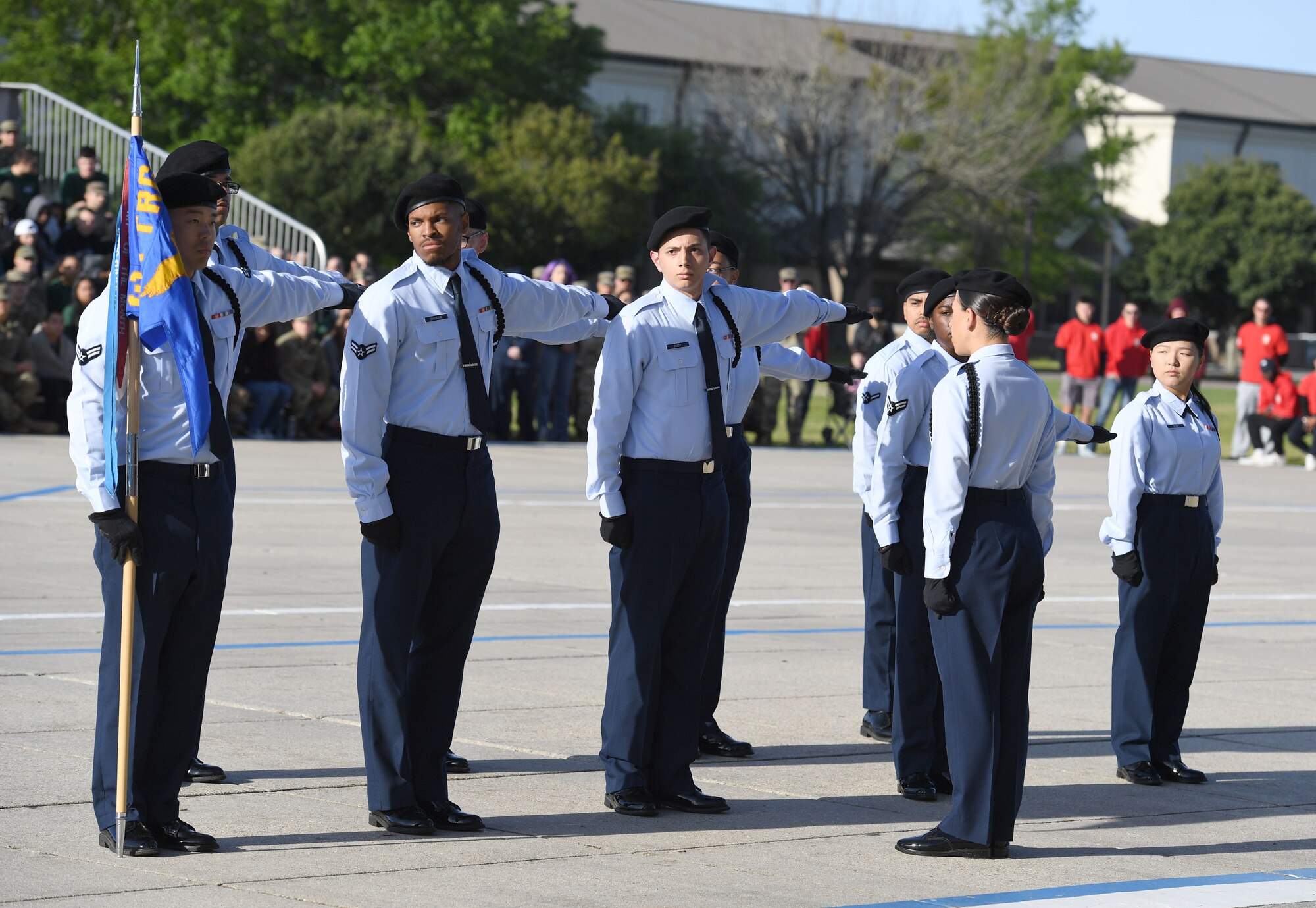 Members of the 338th Training Squadron regulation drill team perform during the 81st Training Group drill down on the Levitow Training Support Facility drill pad at Keesler Air Force Base, Mississippi, April 1, 2022. Keesler trains more than 30,000 students each year. While in training, Airmen are given the opportunity to volunteer to learn and execute drill down routines. (U.S. Air Force photo by Kemberly Groue)
