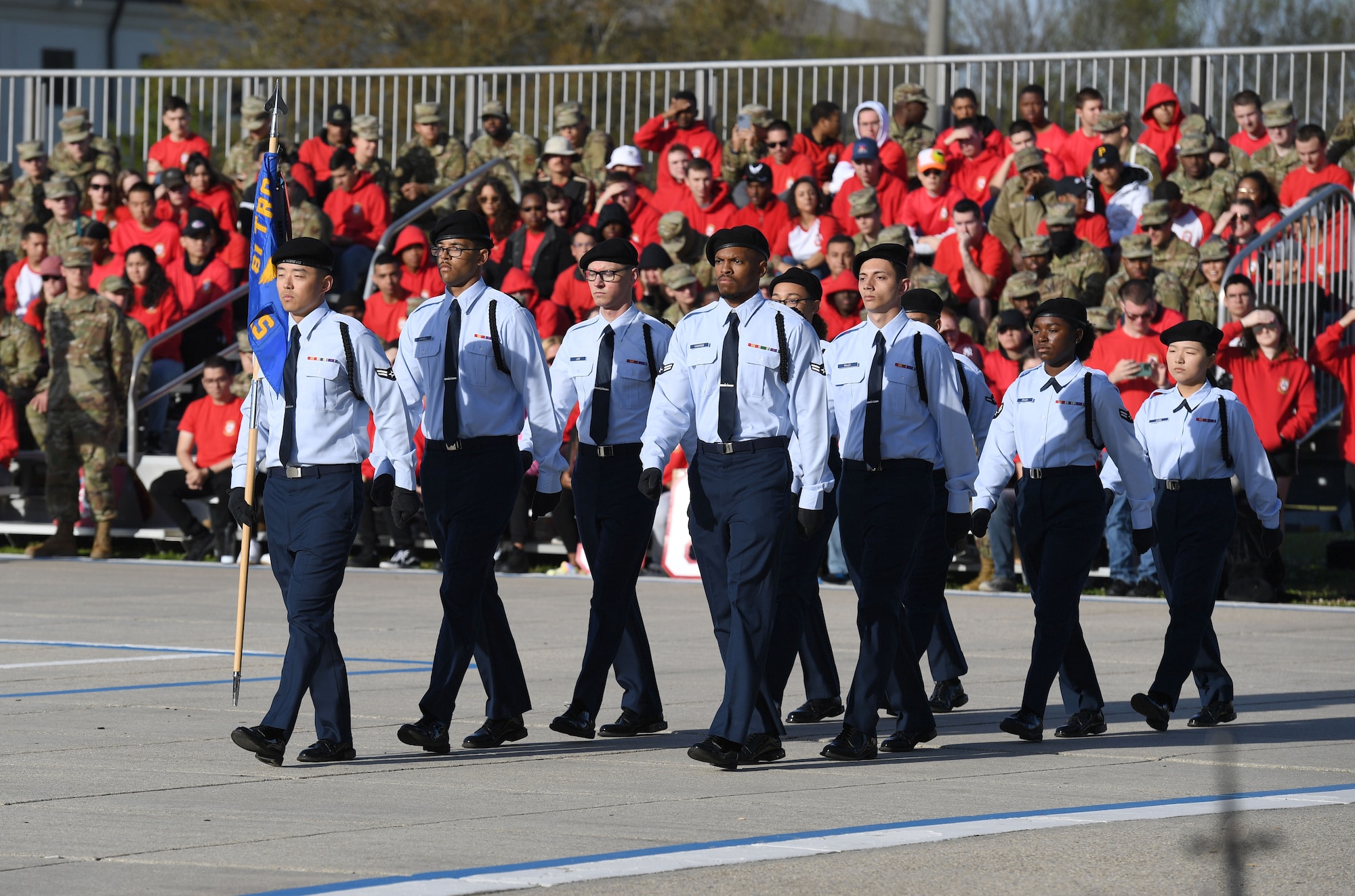 Members of the 338th Training Squadron regulation drill team perform during the 81st Training Group drill down on the Levitow Training Support Facility drill pad at Keesler Air Force Base, Mississippi, April 1, 2022. Keesler trains more than 30,000 students each year. While in training, Airmen are given the opportunity to volunteer to learn and execute drill down routines. (U.S. Air Force photo by Kemberly Groue)