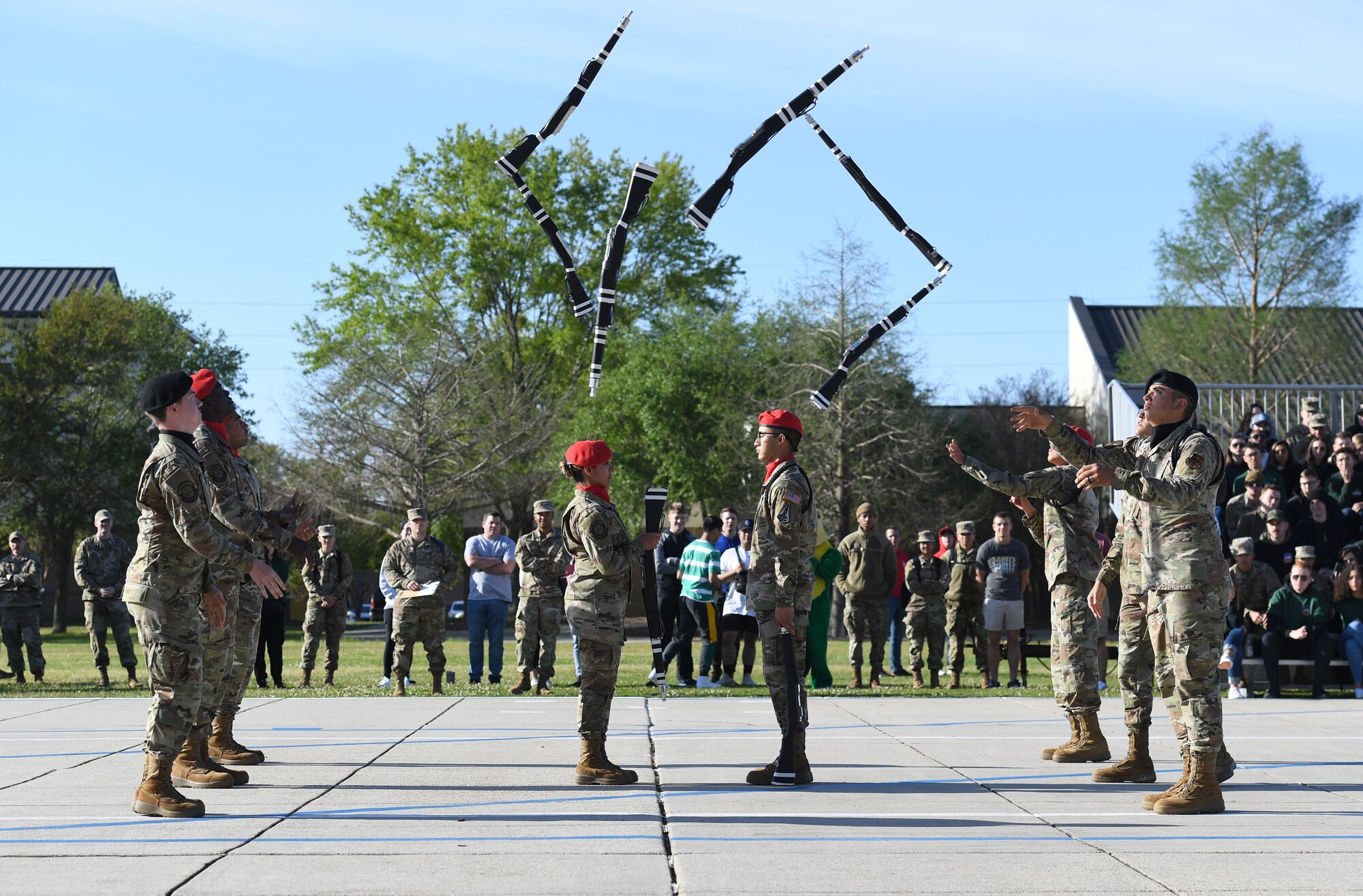 Members of the 336th Training Squadron freestyle drill team perform during the 81st Training Group drill down on the Levitow Training Support Facility drill pad at Keesler Air Force Base, Mississippi, April 1, 2022. Keesler trains more than 30,000 students each year. While in training, Airmen are given the opportunity to volunteer to learn and execute drill down routines. (U.S. Air Force photo by Kemberly Groue)
