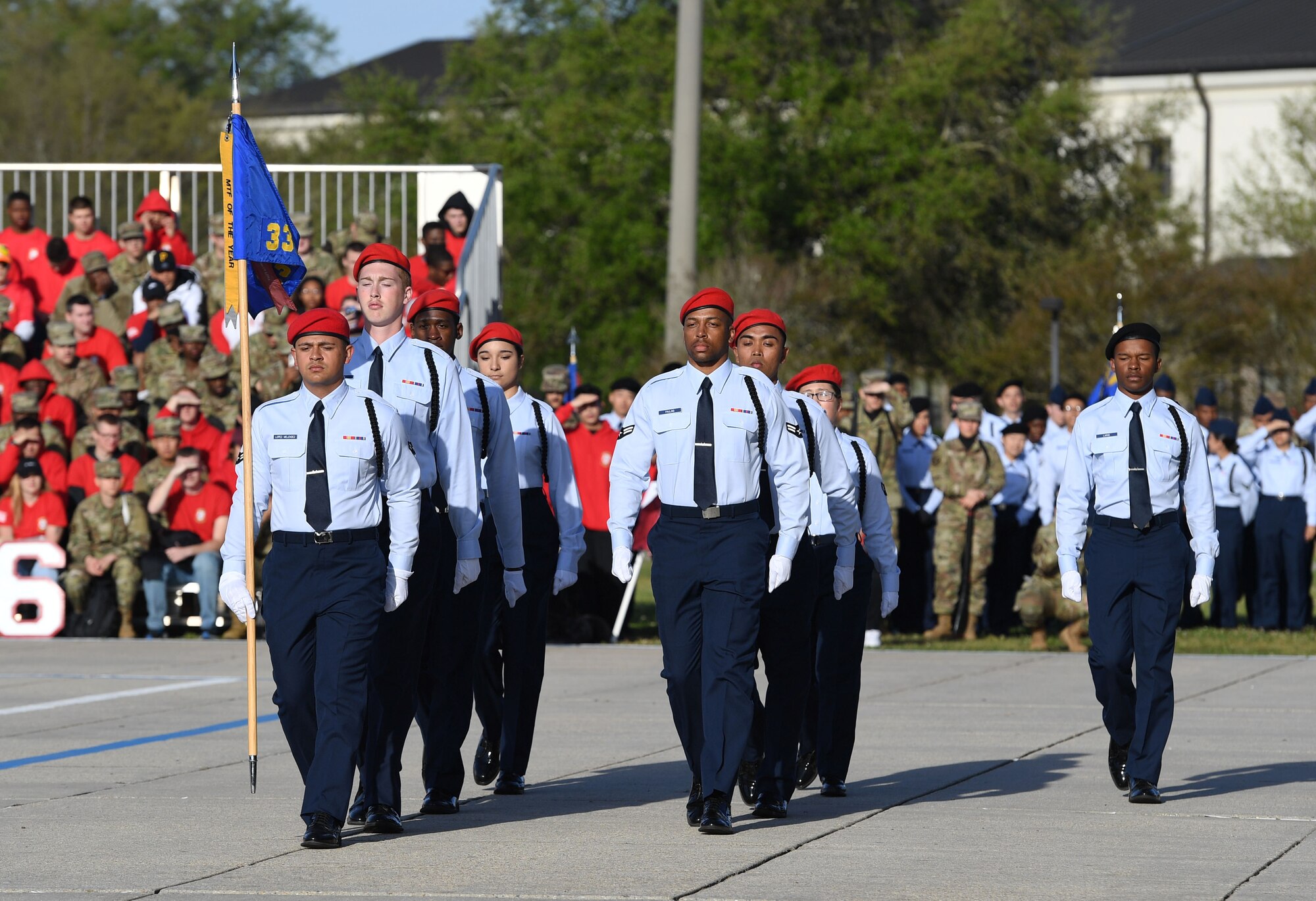 Members of the 336th Training Squadron regulation drill team perform during the 81st Training Group drill down on the Levitow Training Support Facility drill pad at Keesler Air Force Base, Mississippi, April 1, 2022. Keesler trains more than 30,000 students each year. While in training, Airmen are given the opportunity to volunteer to learn and execute drill down routines. (U.S. Air Force photo by Kemberly Groue)